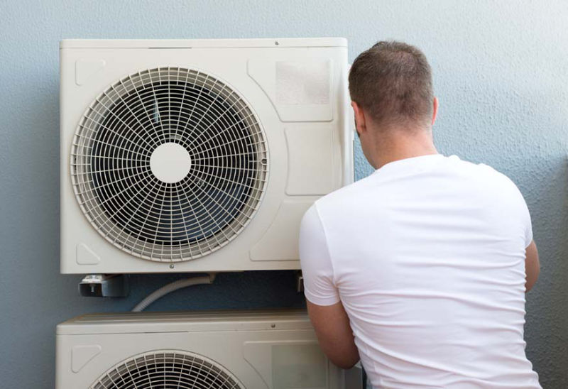 Technician working on AC Unit