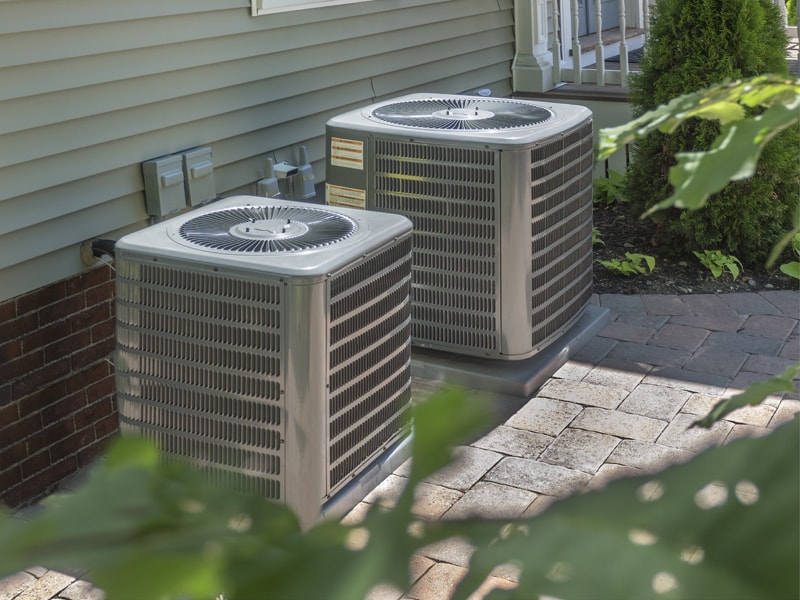 Two central air units outside a home | Purchasing the Right Air Conditioner | Sacramento, CA | Purchasing Right Air Conditioner