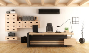 Wooden office with a black ductless air conditioning unit.