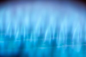 A lit furnace flame. How Does a Gas Furnace Work?